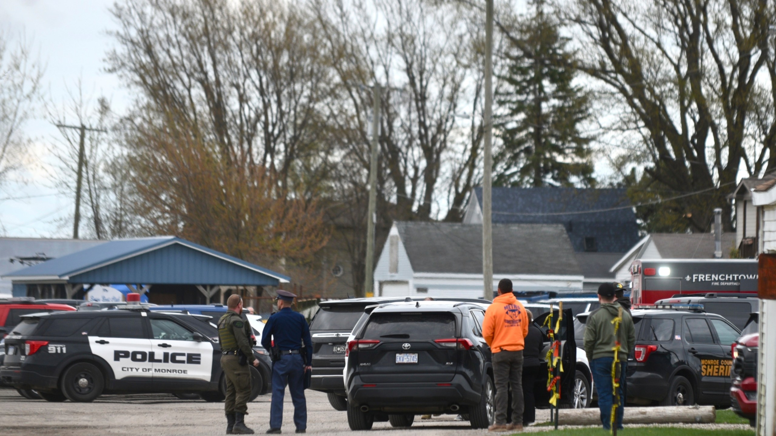 Authorities respond to the Swan Creek Boat Club after a driver crashed a vehicle through a building where a children's birthday party was taking place, Saturday, April 20, 2024, in Berlin Township, Mich. (Kathleen Kildee/Detroit News via AP)