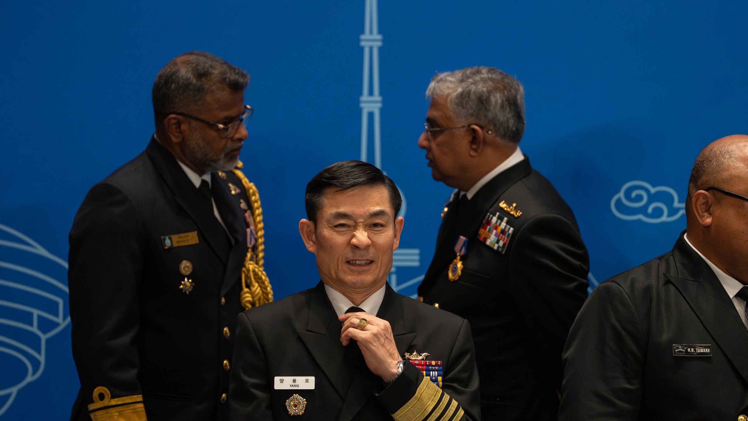 A South Korea's military representative prepares for a group photo before attending the Western Pacific Navy Symposium in Qingdao, eastern China's Shandong province on Monday, April 22, 2024. The meeting has drawn representatives from partners and competitors including Australia, Cambodia, Chile, France, India and the U.S. and comes amid heightened tensions over China's assertive actions in the Taiwan Strait and the East and South China seas, and as China's navy has grown into the world's largest by number of hulls. (AP Photo/Ng Han Guan)