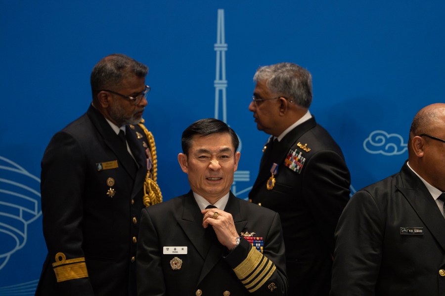 A South Korea's military representative prepares for a group photo before attending the Western Pacific Navy Symposium in Qingdao, eastern China's Shandong province on Monday, April 22, 2024. The meeting has drawn representatives from partners and competitors including Australia, Cambodia, Chile, France, India and the U.S. and comes amid heightened tensions over China's assertive actions in the Taiwan Strait and the East and South China seas, and as China's navy has grown into the world's largest by number of hulls. (AP Photo/Ng Han Guan)