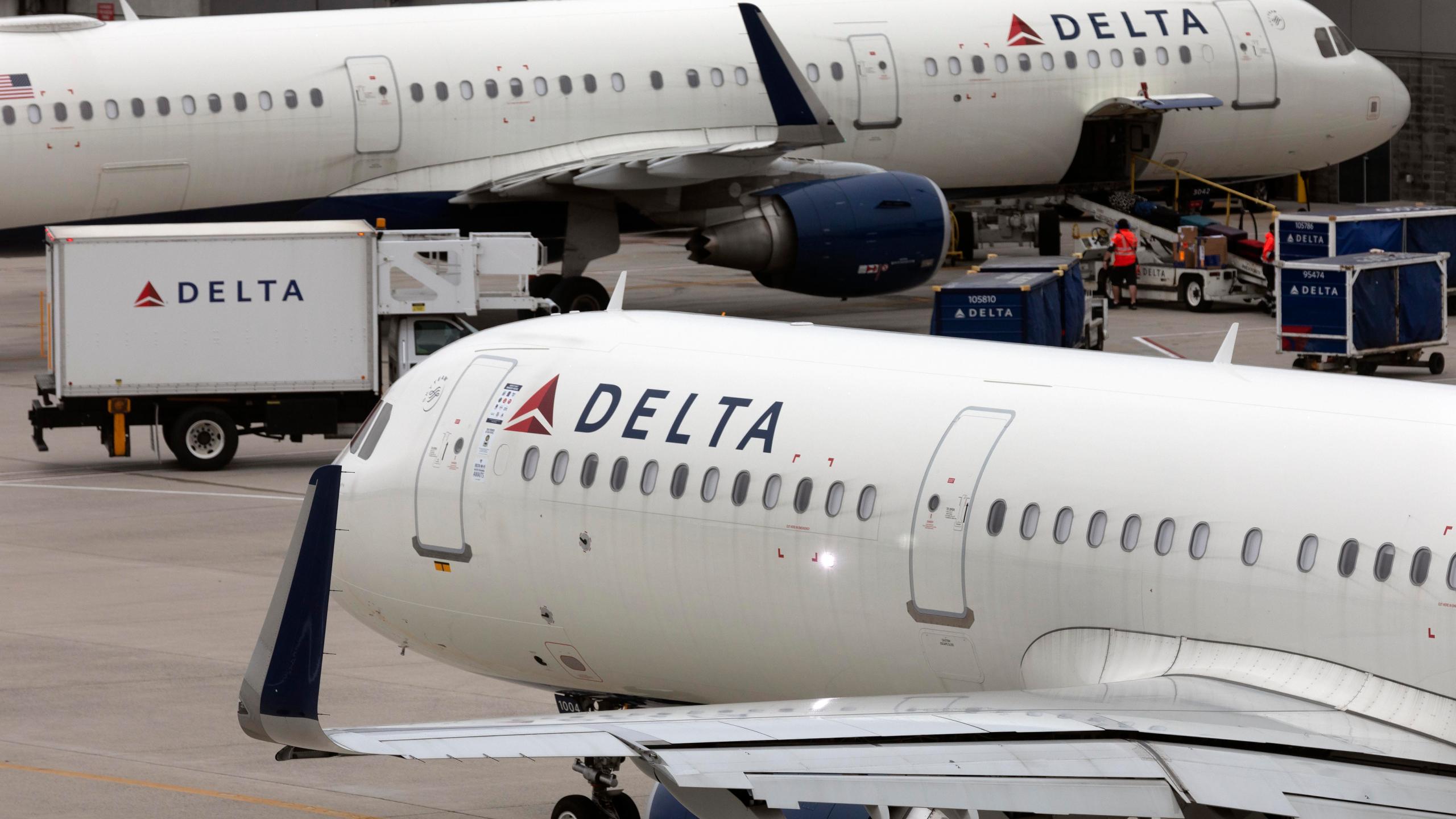 Delta Air Line planes leave the gate July 12, 2021, at Logan International Airport in Boston.