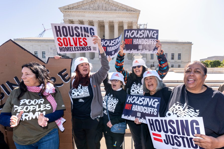 Activists demonstrate at the Supreme Court as the justices consider a challenge to rulings that found punishing people for sleeping outside when shelter space is lacking amounts to unconstitutional cruel and unusual punishment, on Capitol Hill in Washington, Monday, April 22, 2024. (AP Photo/J. Scott Applewhite)