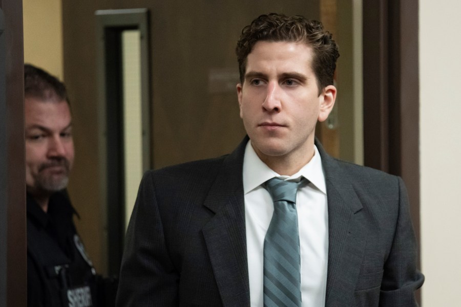 FILE - Bryan Kohberger, right, is escorted into a courtroom for a hearing in Latah County District Court, Sept. 13, 2023, in Moscow, Idaho. A judge says defense attorneys for Kohberger, the man charged in the deaths of four University of Idaho students in late 2022, can resume phone surveys of potential jurors in the case. (AP Photo/Ted S. Warren, Pool, File)