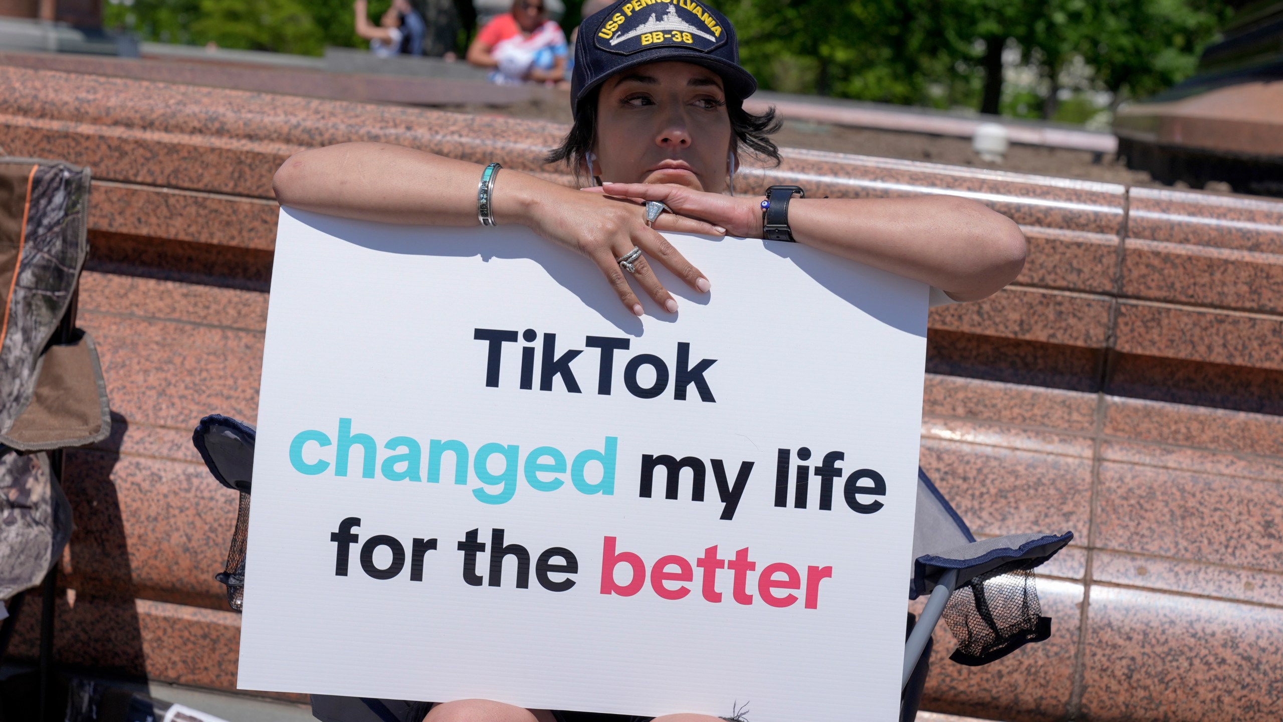 A TikTok content creator, sits outside the U.S. Capitol, Tuesday, April 23, 2024, in Washington as Senators prepare to consider legislation that would force TikTok's China-based parent company to sell the social media platform under the threat of a ban, a contentious move by U.S. lawmakers. (AP Photo/Mariam Zuhaib)