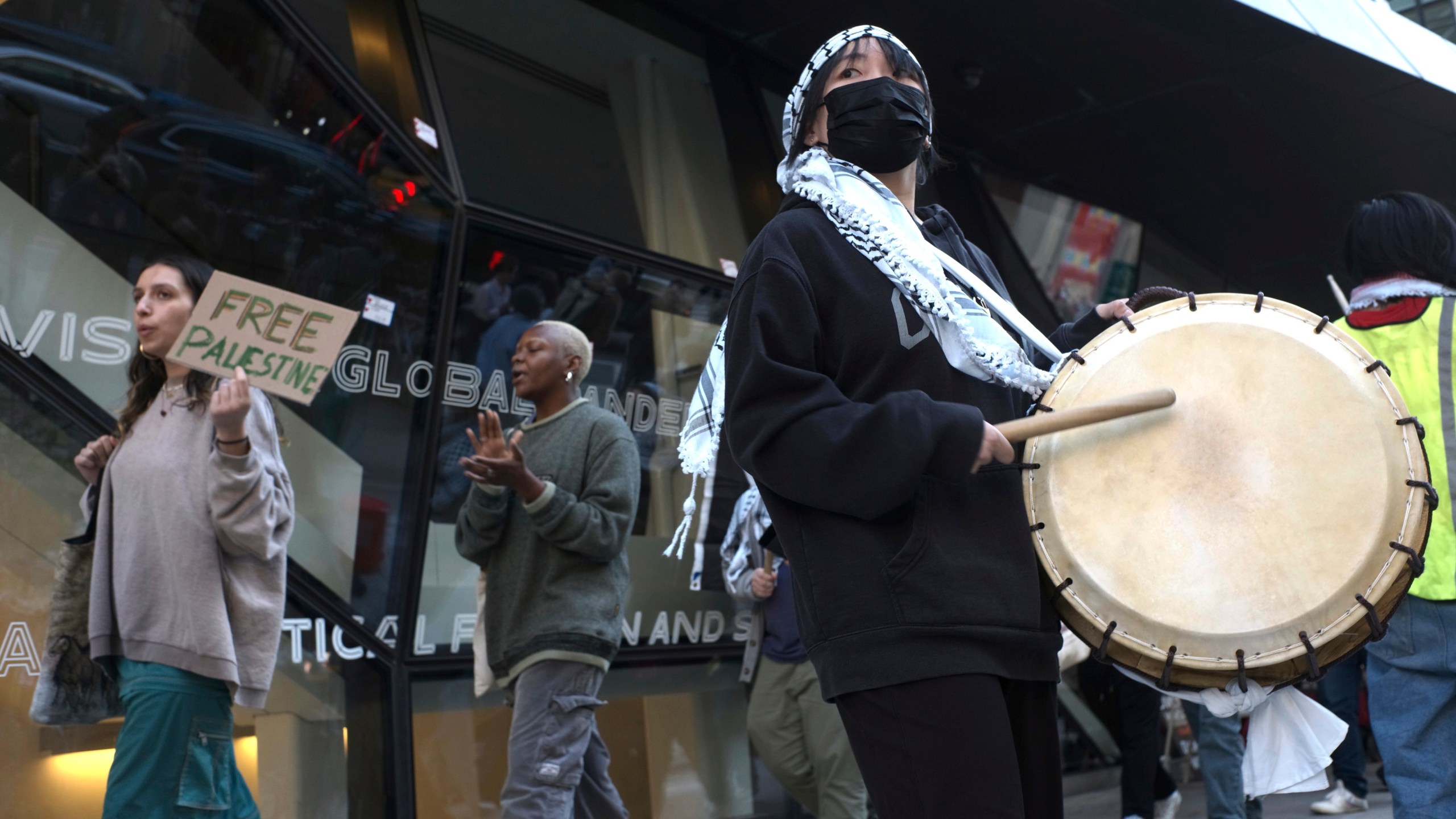 Demonstrators protest against the Israel-Hamas war in front of The New School university in New York on Monday, April 22, 2024. (AP Photo/Patrick Sison)