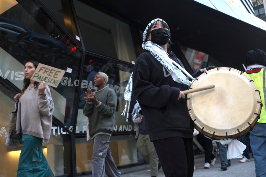 Demonstrators protest against the Israel-Hamas war in front of The New School university in New York on Monday, April 22, 2024. (AP Photo/Patrick Sison)