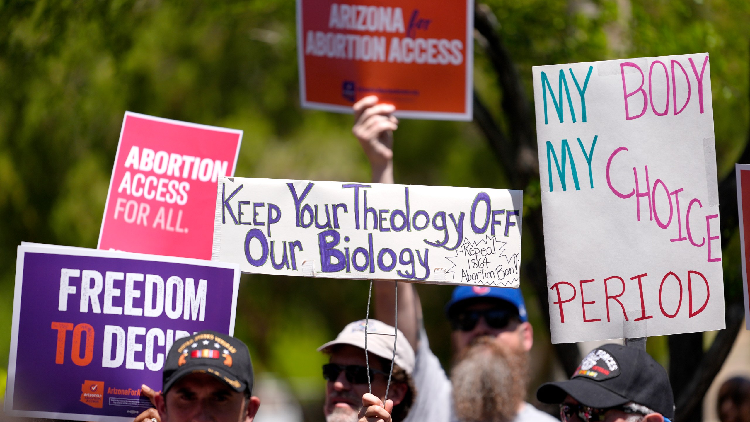 FILE - Abortion rights supporters gather outside the Capitol, Wednesday, April 17, 2024, in Phoenix. Arizona doctors could come to California and provide abortions for their patients under a new proposal announced Wednesday, April 24, 2024, by Gov. Gavin Newsom aimed at circumventing a state law that bans nearly all abortions in that state. (AP Photo/Matt York, File)