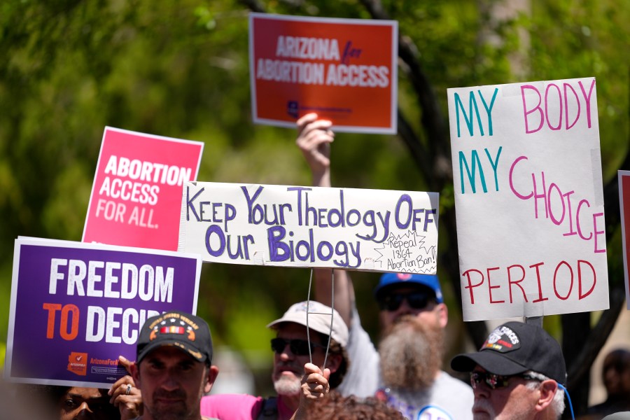 FILE - Abortion rights supporters gather outside the Capitol, Wednesday, April 17, 2024, in Phoenix. Arizona doctors could come to California and provide abortions for their patients under a new proposal announced Wednesday, April 24, 2024, by Gov. Gavin Newsom aimed at circumventing a state law that bans nearly all abortions in that state. (AP Photo/Matt York, File)