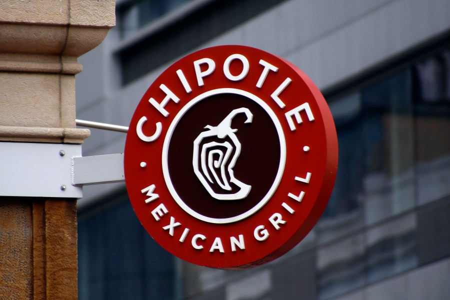 FILE - A sign for the Chipotle restaurant in Pittsburgh's Market Square is pictured Feb. 8, 2016. Last week, the Newport Beach, California-based Mexican chain asked its U.S. and Canadian employees to temporarily select another protein option for their meals to preserve its supply of chicken. But the chain said Thursday, April 25, 2024, that employees can go back to eating chicken again. (AP Photo/Keith Srakocic, File)