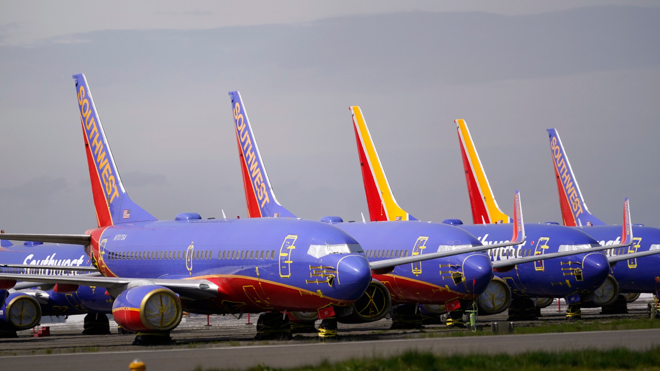 FILE - A line of Southwest Air Boeing 737 jets are parked near the company's production plant while being stored at Paine Field Friday, April 23, 2021, in Everett, Wash. Southwest Air reports earnings on Thursday, April 25, 2024. (AP Photo/Elaine Thompson, File)