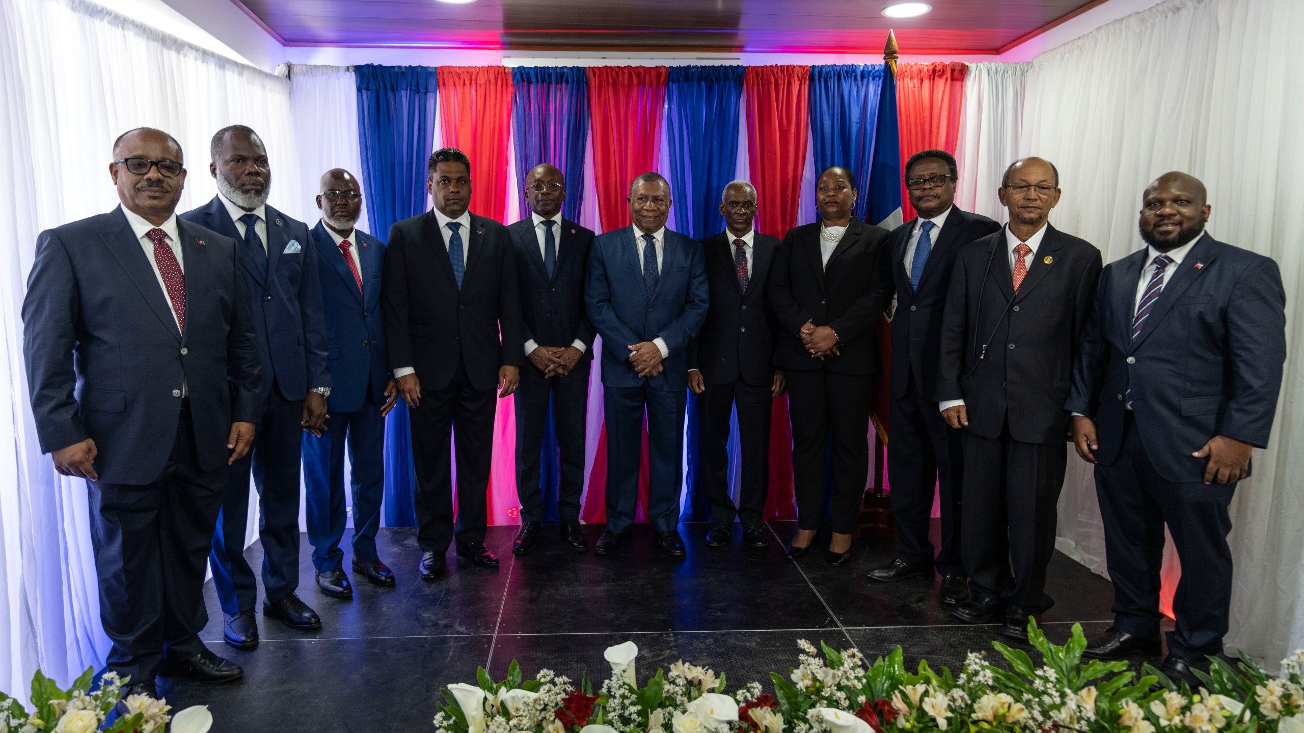 IDENTIFIES TRANSITIONAL COUNCIL MEMBERS - Ex-senator Louis Gerald Gilles, from left to right, pastor Frinel Joseph, barrister Emmanuel Vertilaire, businessman Laurent Saint-Cyr, interim Prime Minister Michel Patrick Boisvert, Judge Jean Joseph Lebrun, who is not a member of the council, former senate president Edgard Leblanc, Regine Abraham, former central bank governor Fritz Alphonse Jean, former diplomat Leslie Voltaire and former ambassador to the Dominican Republic Smith Augustin, pose for a group photo during an installation ceremony, in Port-au-Prince, Haiti, Thursday, April 25, 2024. (AP Photo/Ramon Espinosa)