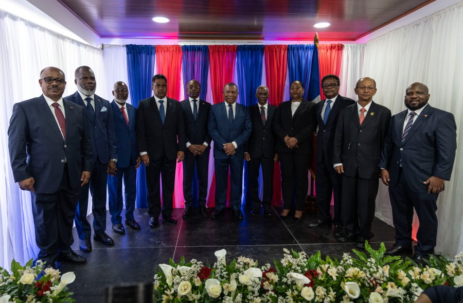 IDENTIFIES TRANSITIONAL COUNCIL MEMBERS - Ex-senator Louis Gerald Gilles, from left to right, pastor Frinel Joseph, barrister Emmanuel Vertilaire, businessman Laurent Saint-Cyr, interim Prime Minister Michel Patrick Boisvert, Judge Jean Joseph Lebrun, who is not a member of the council, former senate president Edgard Leblanc, Regine Abraham, former central bank governor Fritz Alphonse Jean, former diplomat Leslie Voltaire and former ambassador to the Dominican Republic Smith Augustin, pose for a group photo during an installation ceremony, in Port-au-Prince, Haiti, Thursday, April 25, 2024. (AP Photo/Ramon Espinosa)