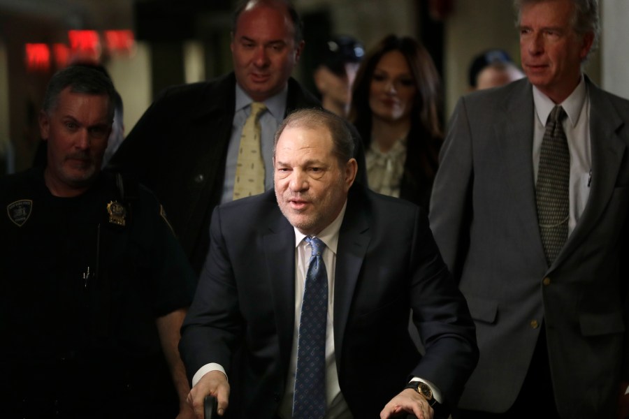 FILE - Harvey Weinstein arrives at a Manhattan courthouse for jury deliberations in his rape trial, Monday, Feb. 24, 2020, in New York. New York's highest court has overturned Harvey Weinstein's 2020 rape conviction and ordered a new trial. (AP Photo/Seth Wenig, File)