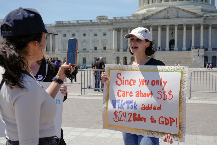 A TikTok content creator, speaks to reporters outside the U.S. Capitol, Tuesday, April 23, 2024, in Washington, as Senators prepare to consider legislation that would force TikTok's China-based parent company to sell the social media platform under the threat of a ban, a contentious move by U.S. lawmakers. (AP Photo/Mariam Zuhaib)