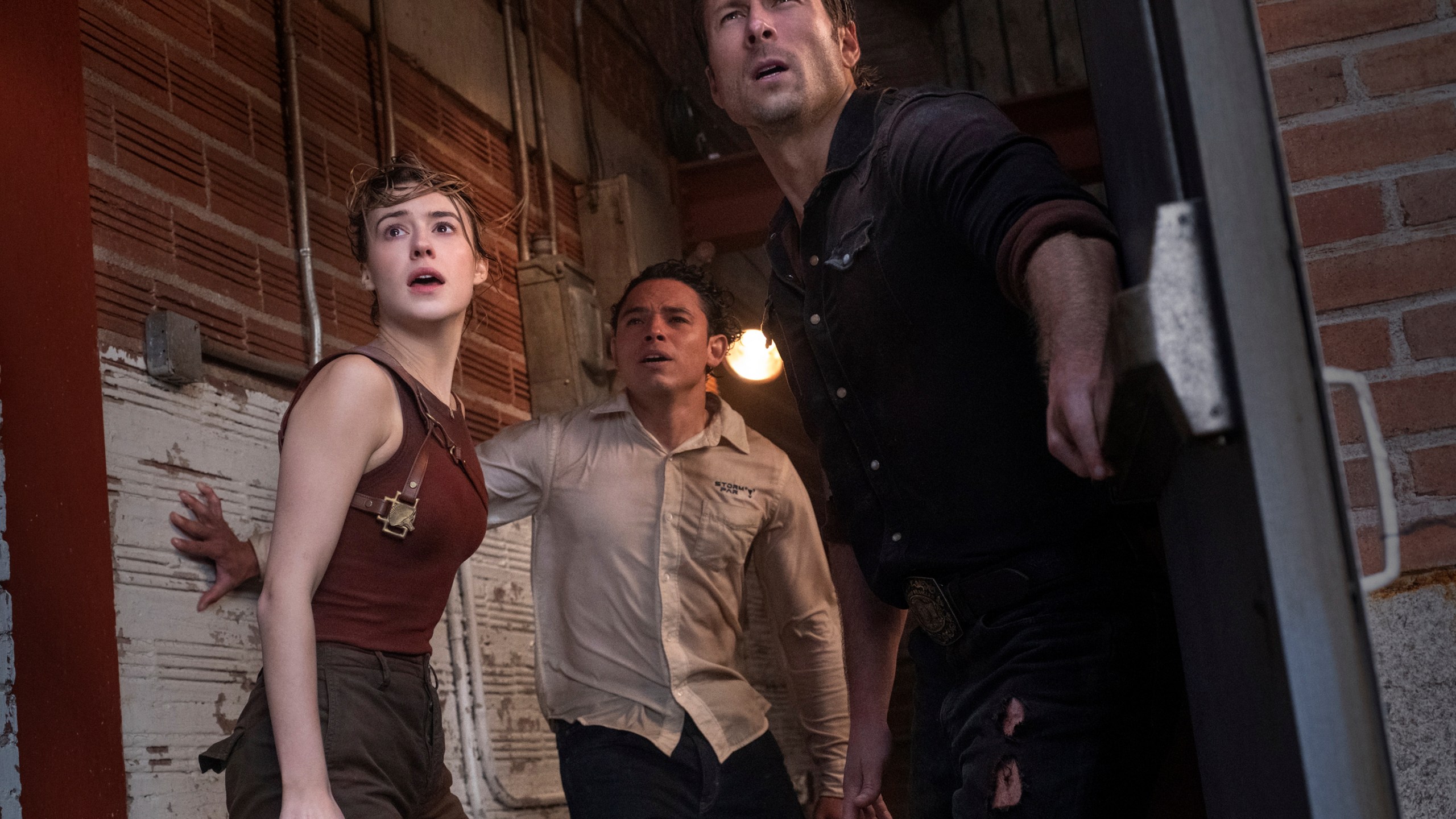 This image released by Universal Pictures shows Daisy Edgar-Jones, from left, Anthony Ramos and Glen Powell in a scene from "Twisters." (Melinda Sue Gordon/Universal Pictures via AP)