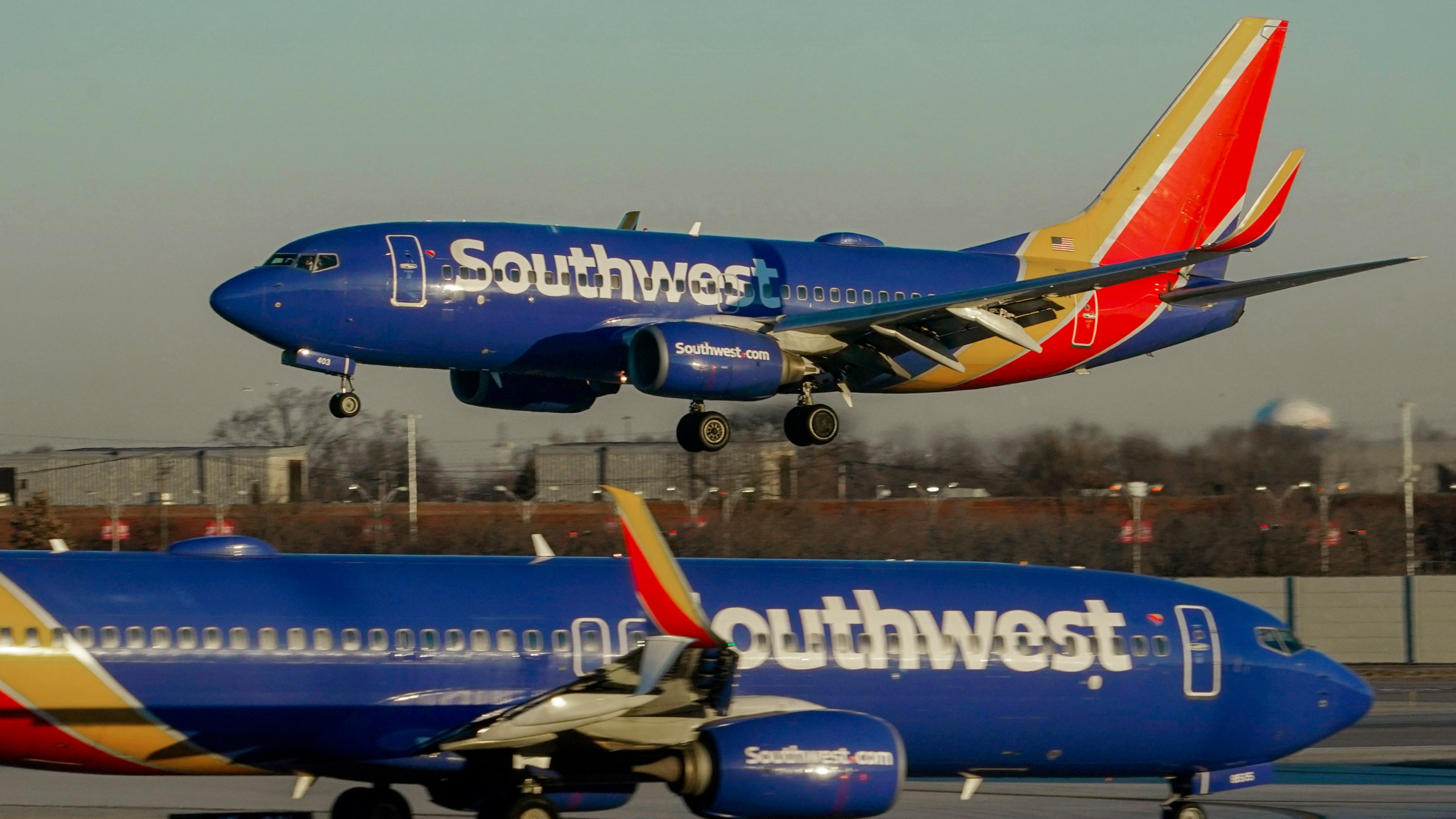 FILE - Southwest Airlines plane prepares to land at Midway International Airport, Feb. 12, 2023, in Chicago. Flight attendants at Southwest Airlines on Wednesday, April 24, 2024, ratified a contract that includes pay raises totaling more than 33% over four years, as airline workers continue to benefit from the industry's recovery since the pandemic. (AP Photo/Kiichiro Sato, File)