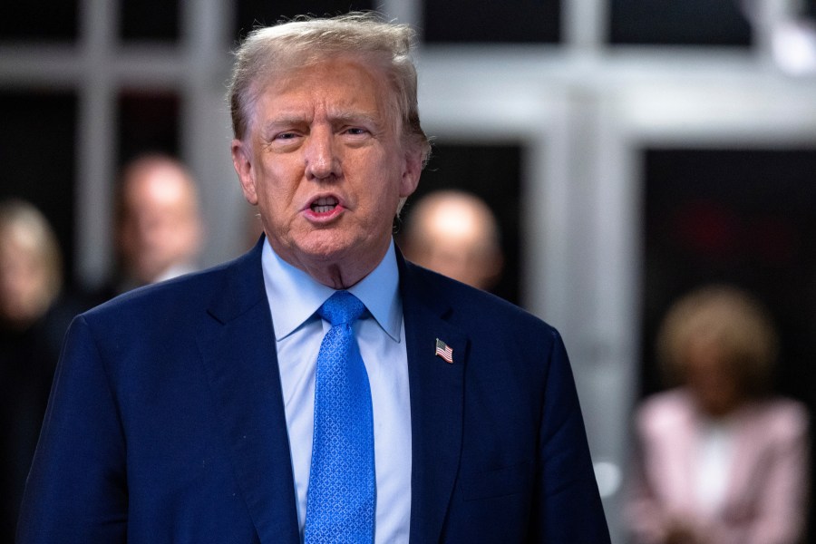 Former President Donald Trump speaks to members of the media as he arrives at Manhattan criminal court in New York, Friday, April 26, 2024. (Michael M. Santiago/Getty Images)