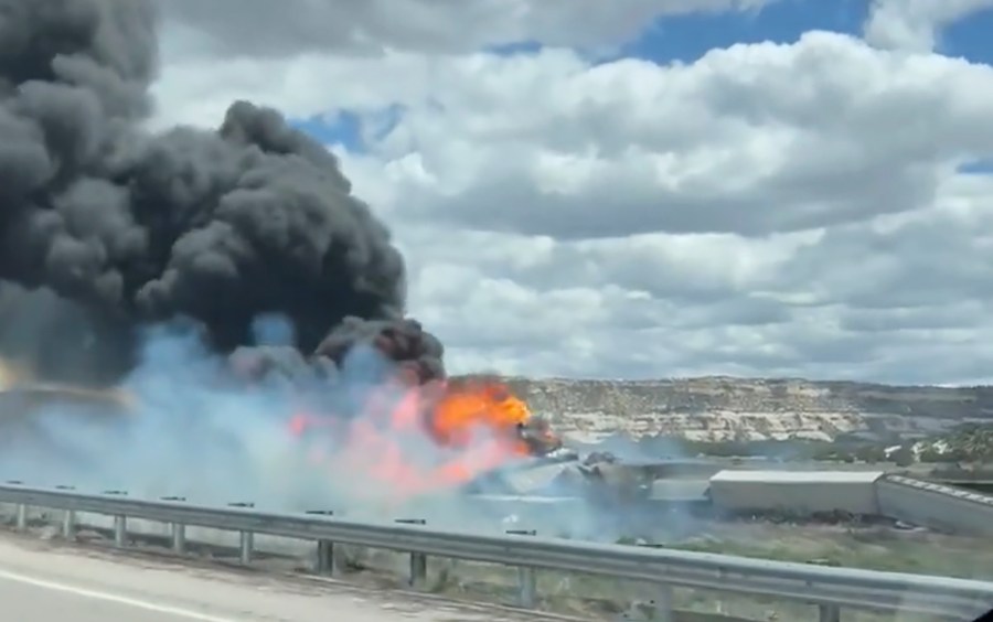 This frame grab taken from video provided by Bryan Wilson, shows a freight train carrying fuel that derailed and caught fire, Friday, April 26, 2024, near the New Mexico-Arizona state line, east of Lupton, Ariz. Authorities closed Interstate 40 in both directions in the area, directing trucks and motorists to alternate routes. (Bryan Wilson via AP)