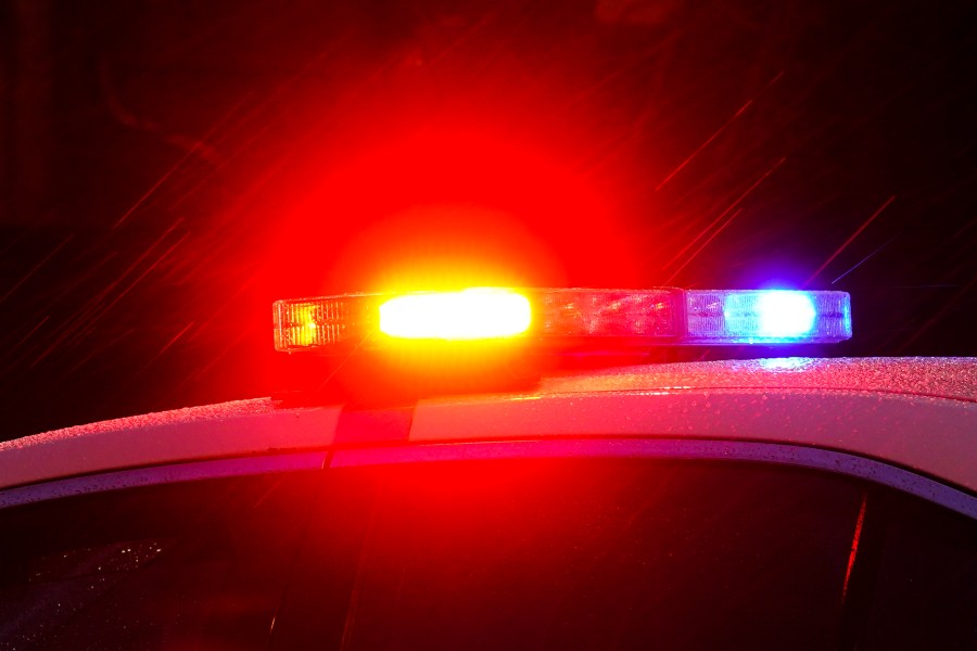 FILE - Shown is a Philadelphia police car with flashing lights in Philadelphia, Monday, Jan. 17, 2022. Police departments reported a year-over-year increase in sworn officers in 2023 for the first time since the COVID-19 pandemic began and since the 2020 police killing of George Floyd spurred nationwide protests and increased scrutiny of police, according to a survey released by the Police Executive Research Forum. (AP Photo/Matt Rourke, File)