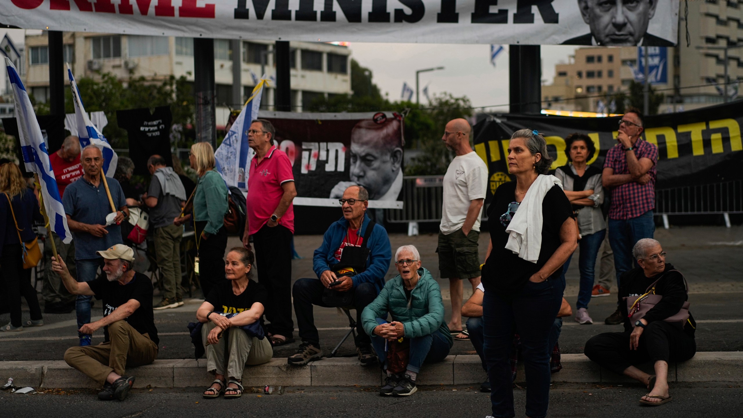 People protest against Israeli Prime Minister Benjamin Netanyahu's government in Tel Aviv, Israel, Saturday, April 27, 2024. (AP Photo/Ohad Zwigenberg)