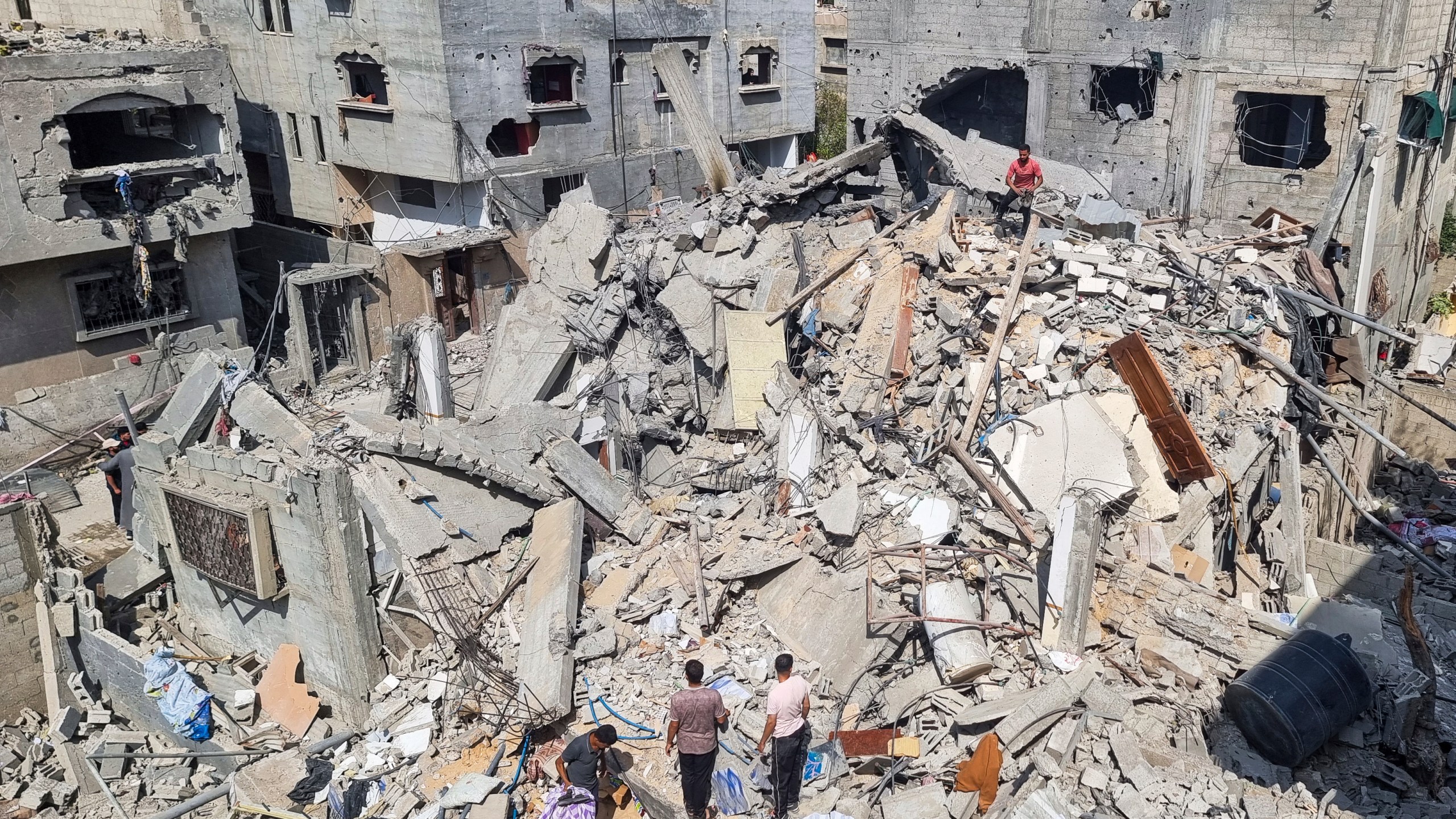 Palestinians look at the destruction after an Israeli airstrike in Rafah, Gaza Strip. Monday, April 29, 2024. (AP Photo/Mohammad Jahjouh)