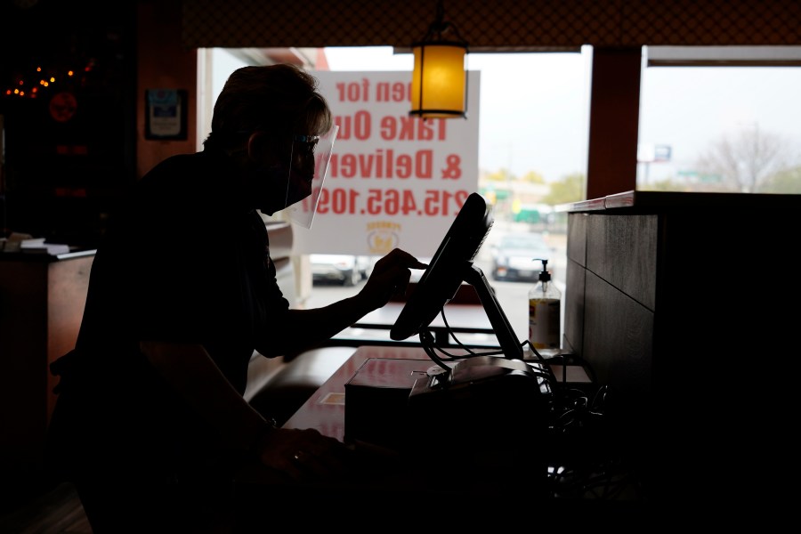 FILE - An order is entered by an employee at a diner on Nov. 17, 2020, in Philadelphia. It's never fun to be scammed, but if you're a small business owner falling for a scam can have long-lasting effects on a business, damaging client relationships and profit. (AP Photo/Matt Slocum, File)