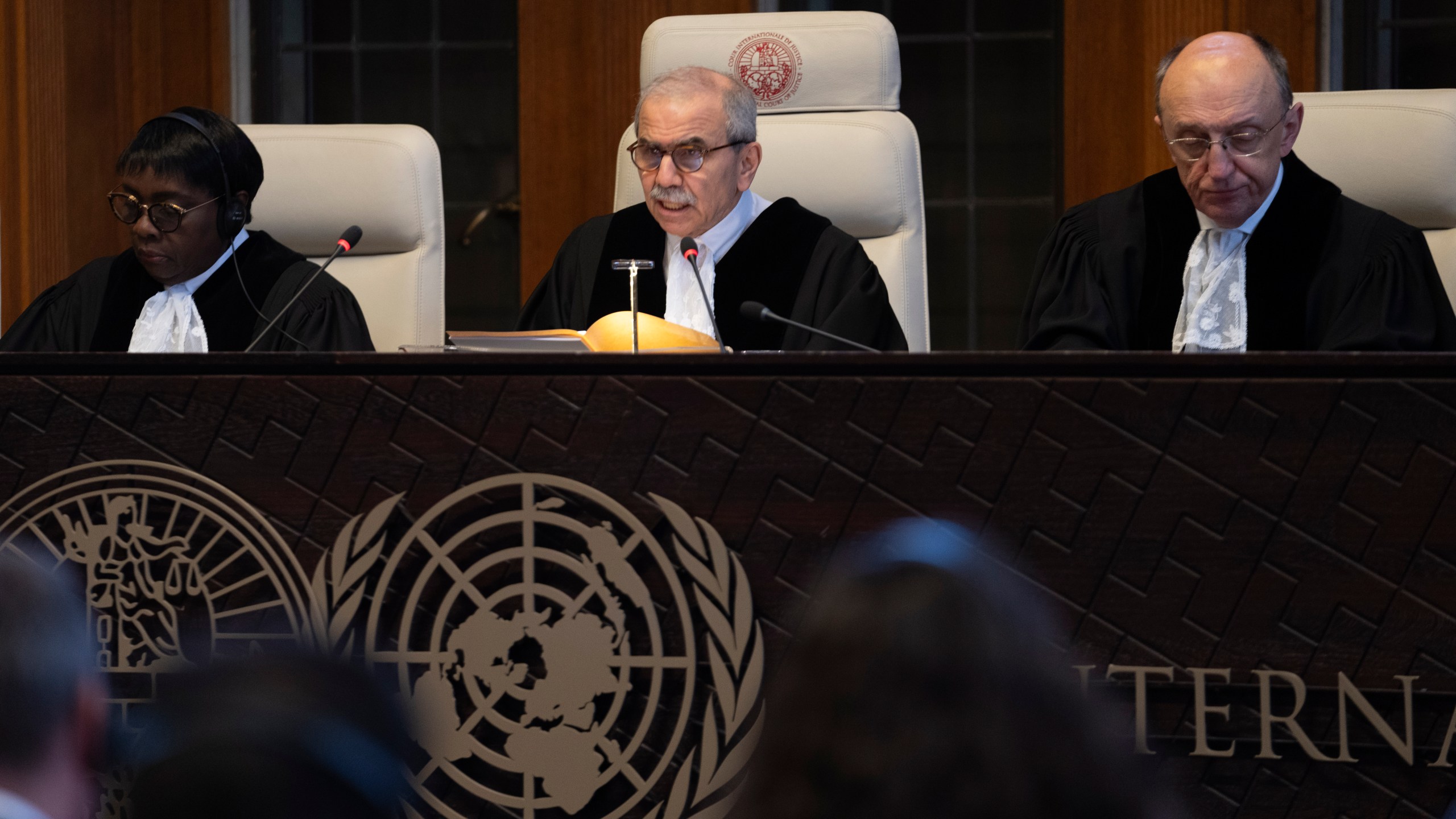 Presiding judge Nawaf Salam, center, opens the court session of the International Court of Justice in The Hague, Netherlands, Tuesday, April 30, 2024, where the United Nations' top court is ruling on a request by Nicaragua for judges to order Germany to halt military aid to Israel, arguing that Berlin's support enables acts of genocide and breaches of international humanitarian law in Gaza. (AP Photo/Peter Dejong)