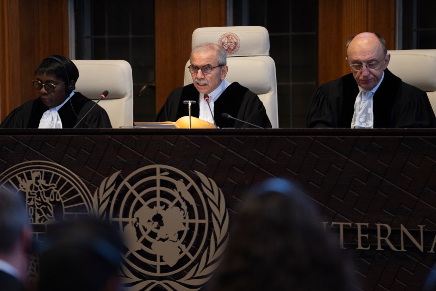 Presiding judge Nawaf Salam, center, opens the court session of the International Court of Justice in The Hague, Netherlands, Tuesday, April 30, 2024, where the United Nations' top court is ruling on a request by Nicaragua for judges to order Germany to halt military aid to Israel, arguing that Berlin's support enables acts of genocide and breaches of international humanitarian law in Gaza. (AP Photo/Peter Dejong)