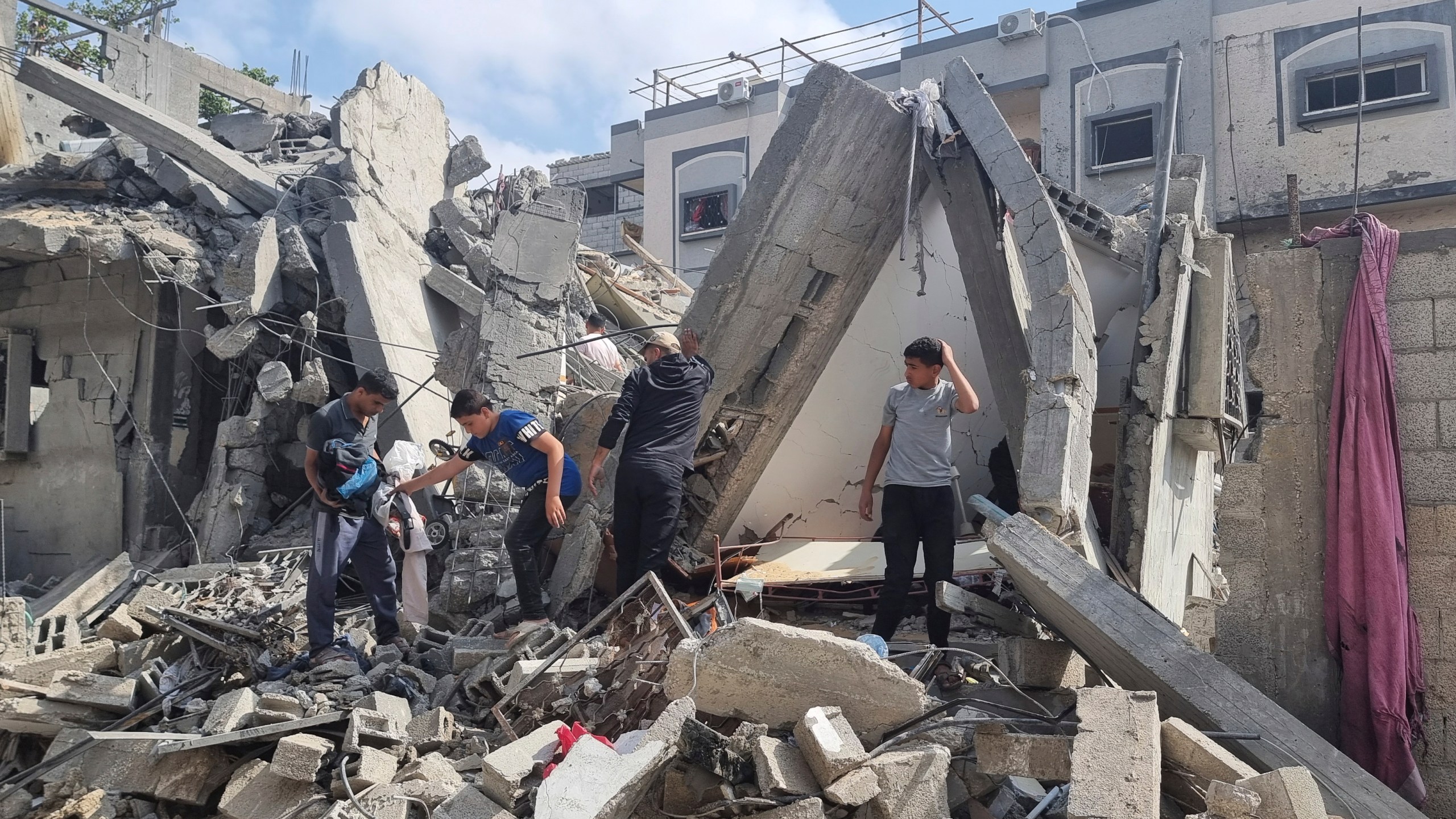 Palestinians look at the destruction after an Israeli airstrike in Rafah, Gaza Strip. Monday, April 29, 2024. (AP Photo/Mohammad Jahjouh)