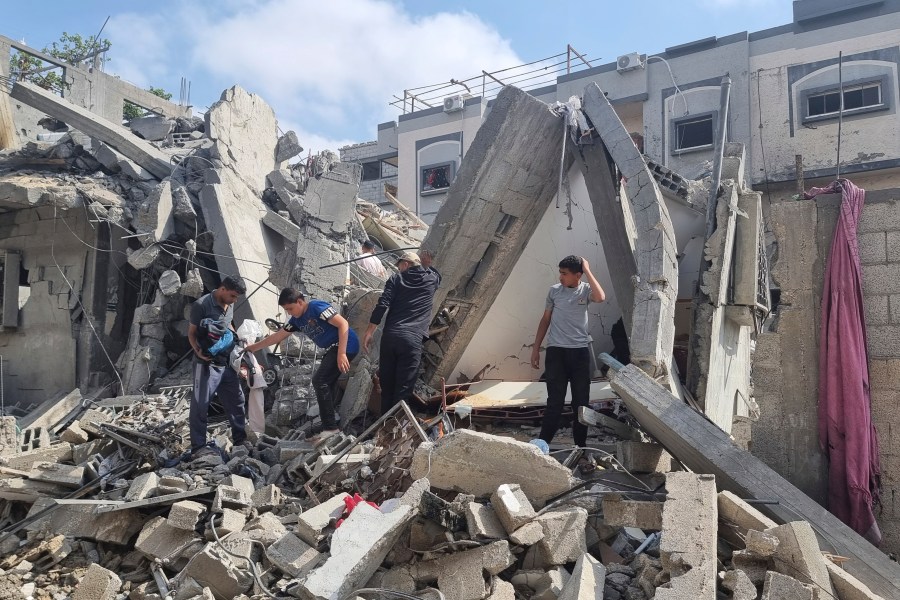 Palestinians look at the destruction after an Israeli airstrike in Rafah, Gaza Strip. Monday, April 29, 2024. (AP Photo/Mohammad Jahjouh)