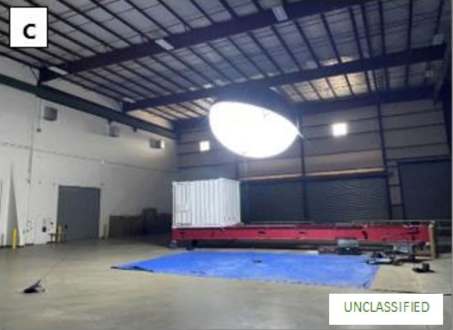 A rounded light balloon in a warehouse.