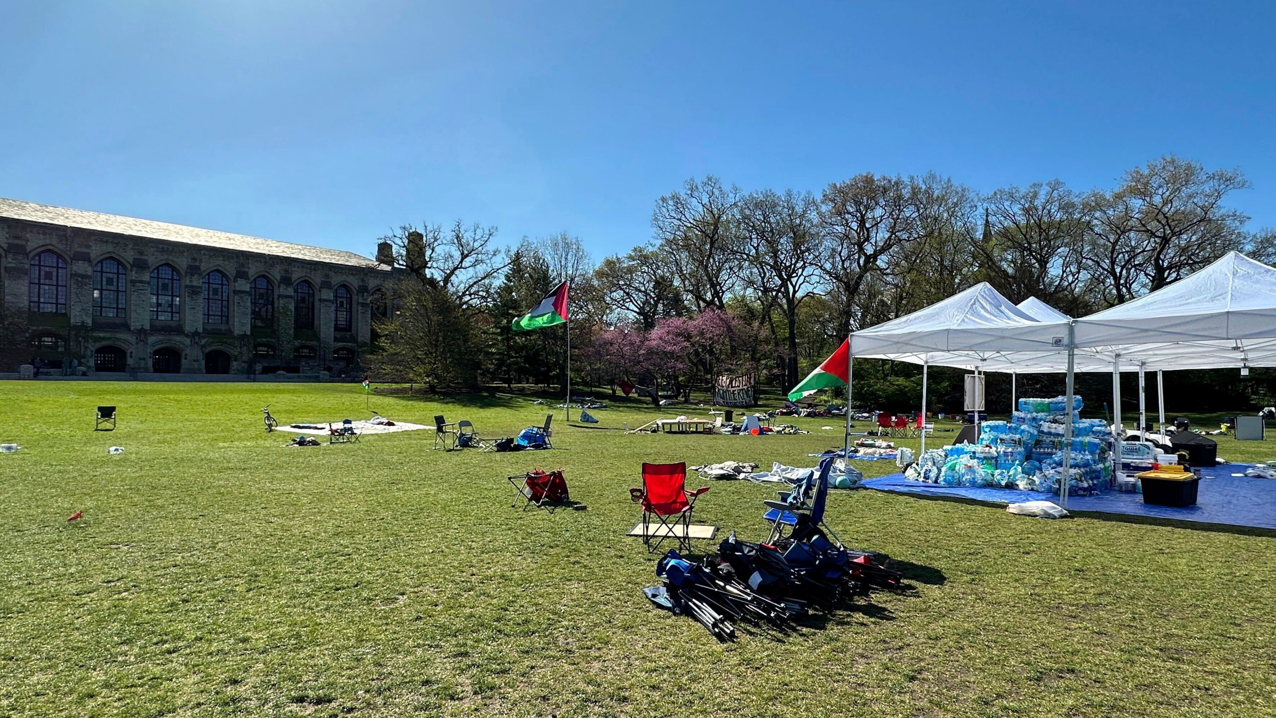 Tents, flags and other supplies remain at Deering Meadow on Northwestern University's campus in Evanston, Ill. on Tuesday, April 30, 2024, a day after the university and protest organizers announced an agreement which largely ended anti-war demonstrations that have lasted days. (AP Photo/Melissa Perez Winder)