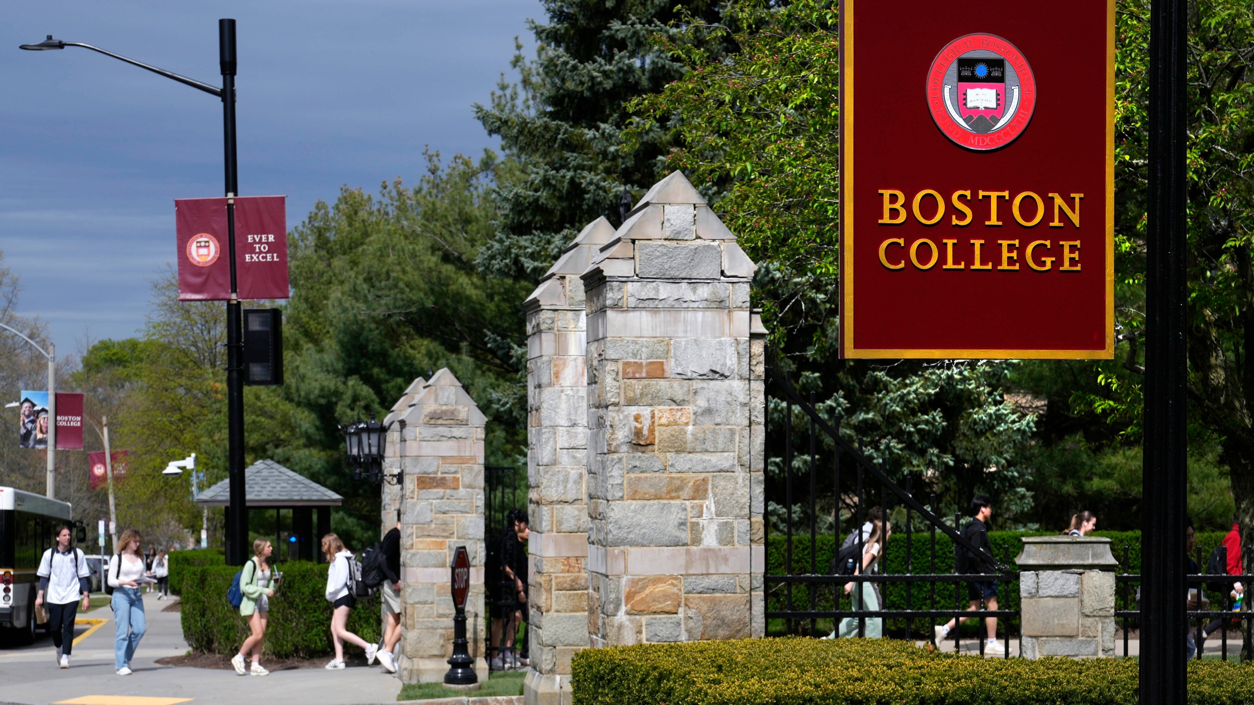 Students walk on the campus of Boston College, Monday, April 29, 2024, in Boston. While many colleges and universities in the Boston area have been scenes of encampments and arrests, Boston College has been relatively quiet. (AP Photo/Charles Krupa)