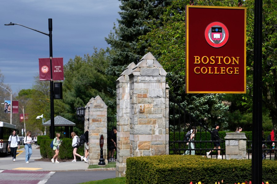 Students walk on the campus of Boston College, Monday, April 29, 2024, in Boston. While many colleges and universities in the Boston area have been scenes of encampments and arrests, Boston College has been relatively quiet. (AP Photo/Charles Krupa)