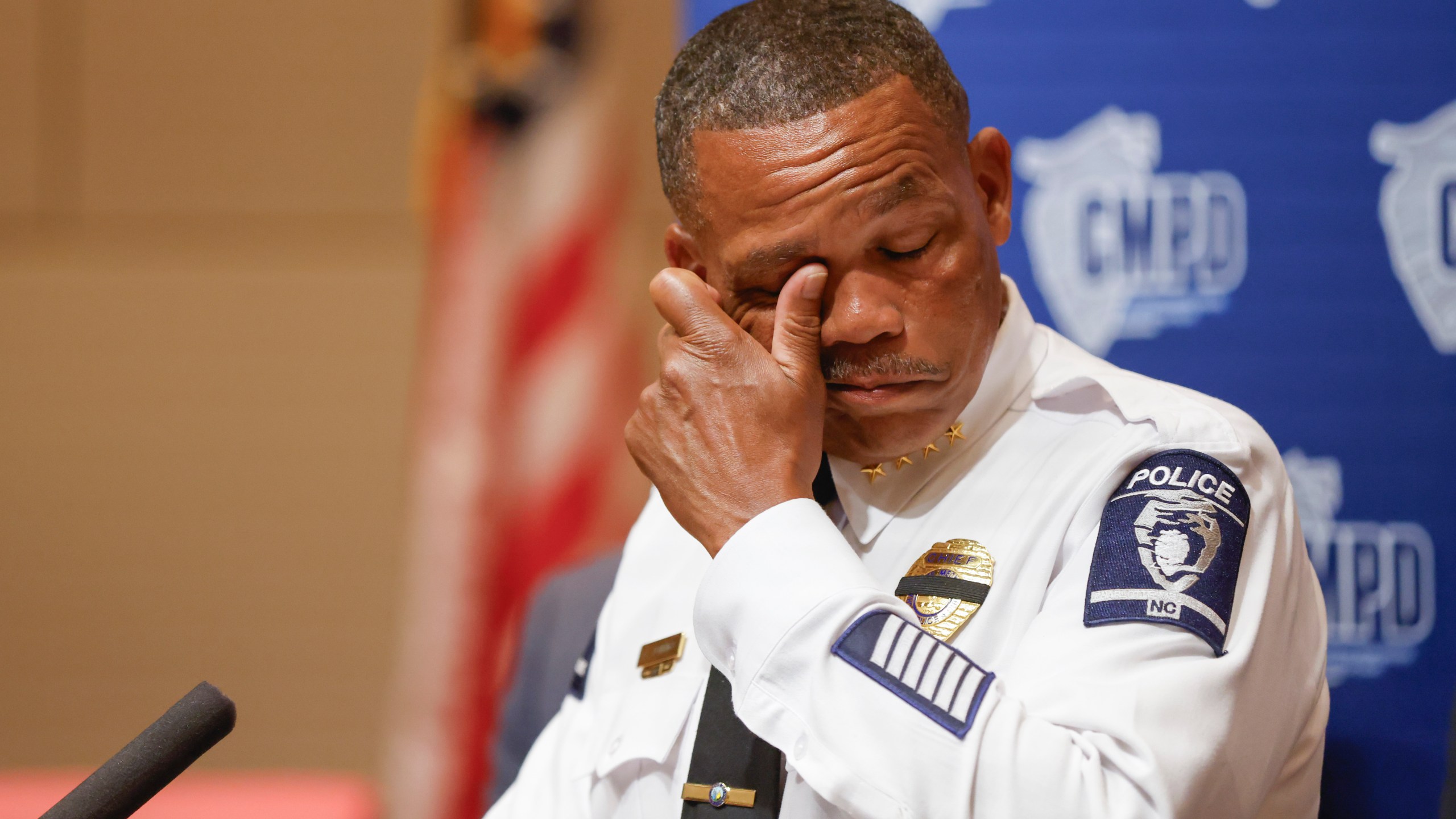 Charlotte-Mecklenburg Police Chief Johnny Jennings wipes away tears as he speaks at a press conference in Charlotte, N.C., Tuesday, April 30, 2024, regarding the shooting that killed four officers during an attempt to serve a warrant on April 29. (AP Photo/Nell Redmond)