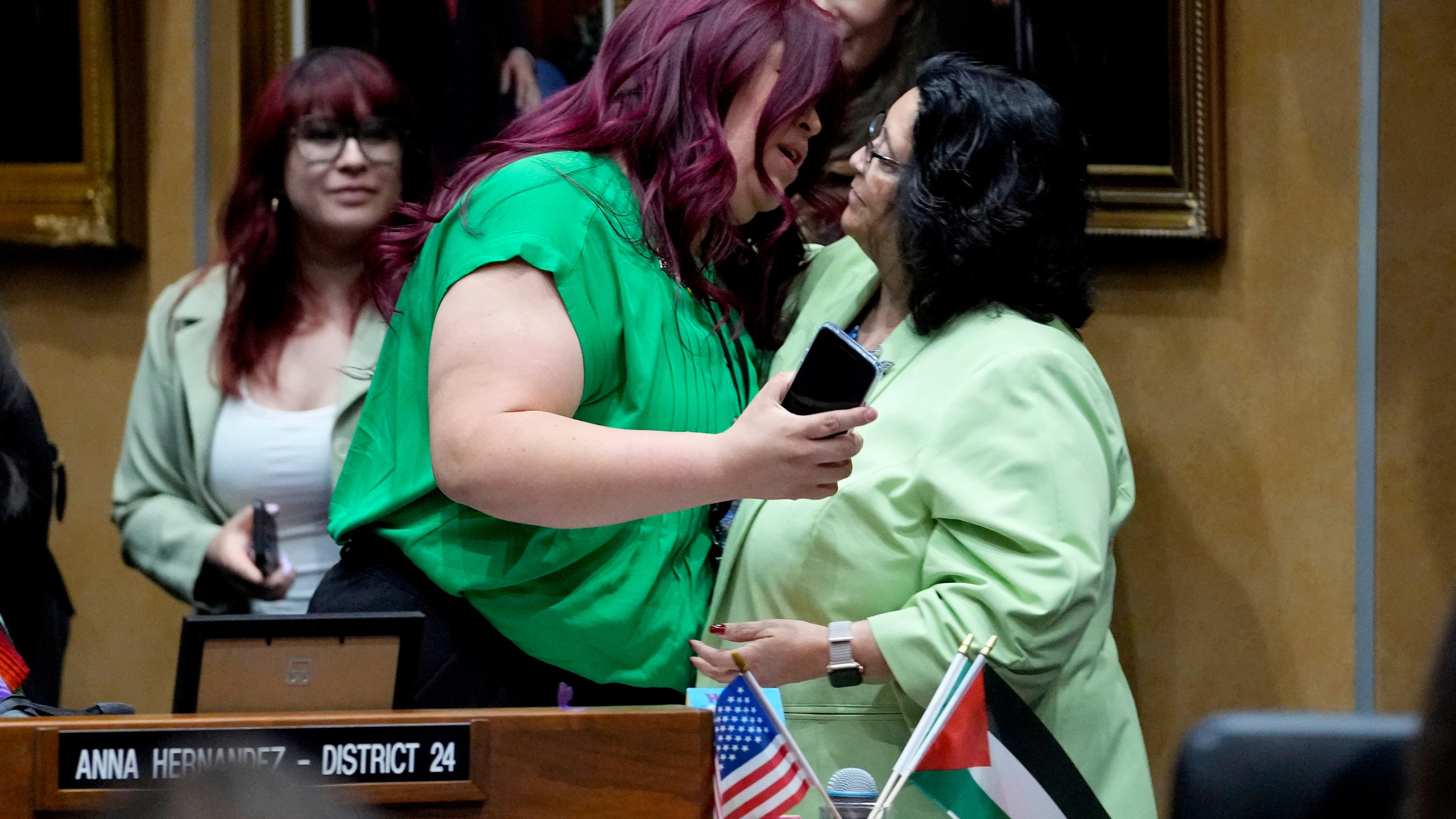 Democratic Arizona state senator Anna Hernandez, D-District 24, left, hugs a colleague after a their vote, Wednesday, May 1, 2024, at the Capitol in Phoenix. Democrats secured enough votes in the Arizona Senate to repeal a Civil War-era ban on abortions that the state's highest court recently allowed to take effect. (AP Photo/Matt York)