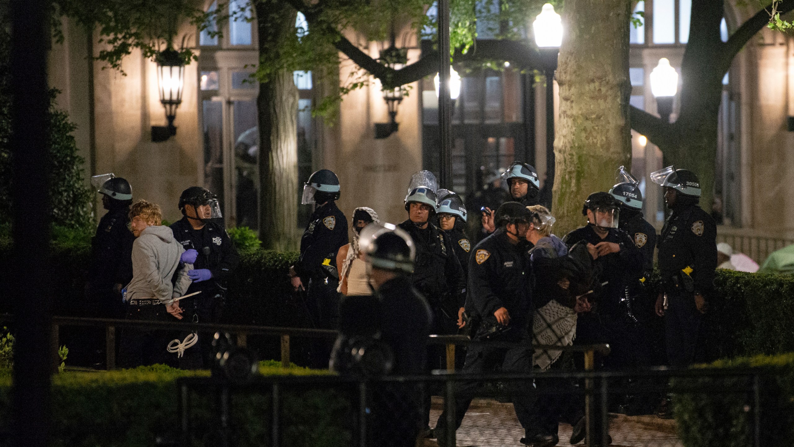 Officers with the New York Police Department arrest Pro-Palestinian protesters at Columbia University, Tuesday, April 30, 2024, in New York. The protesters had seized the administration building, known as Hamilton Hall, more than 20 hours earlier in a major escalation as demonstrations against the Israel-Hamas war spread on college campuses nationwide. (Marco Postigo Storel via AP)