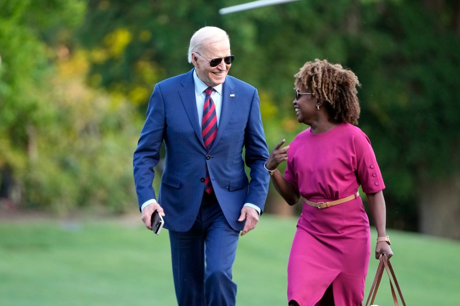 President Joe Biden walks across the South Lawn of the White House as he talks with White House press secretary Karine Jean-Pierre Thursday, May 2, 2024, in Washington, after returning from a trip to North Carolina. (AP Photo/Mark Schiefelbein)