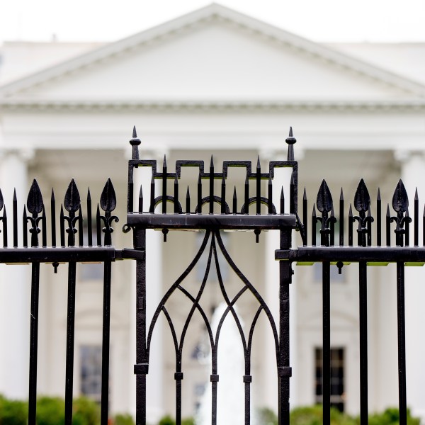 FILE - The White House is visible through the fence at the North Lawn in Washington, on June 16, 2016. A driver died Saturday night, May 4, 2024 after crashing a vehicle into a gate at the White House, authorities said. (AP Photo/Andrew Harnik, File)