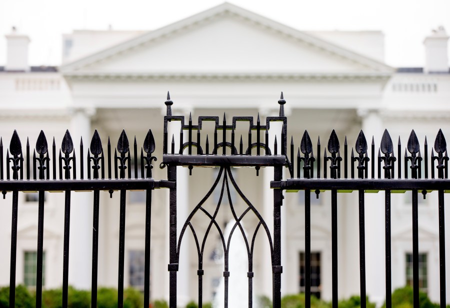 FILE - The White House is visible through the fence at the North Lawn in Washington, on June 16, 2016. A driver died Saturday night, May 4, 2024 after crashing a vehicle into a gate at the White House, authorities said. (AP Photo/Andrew Harnik, File)