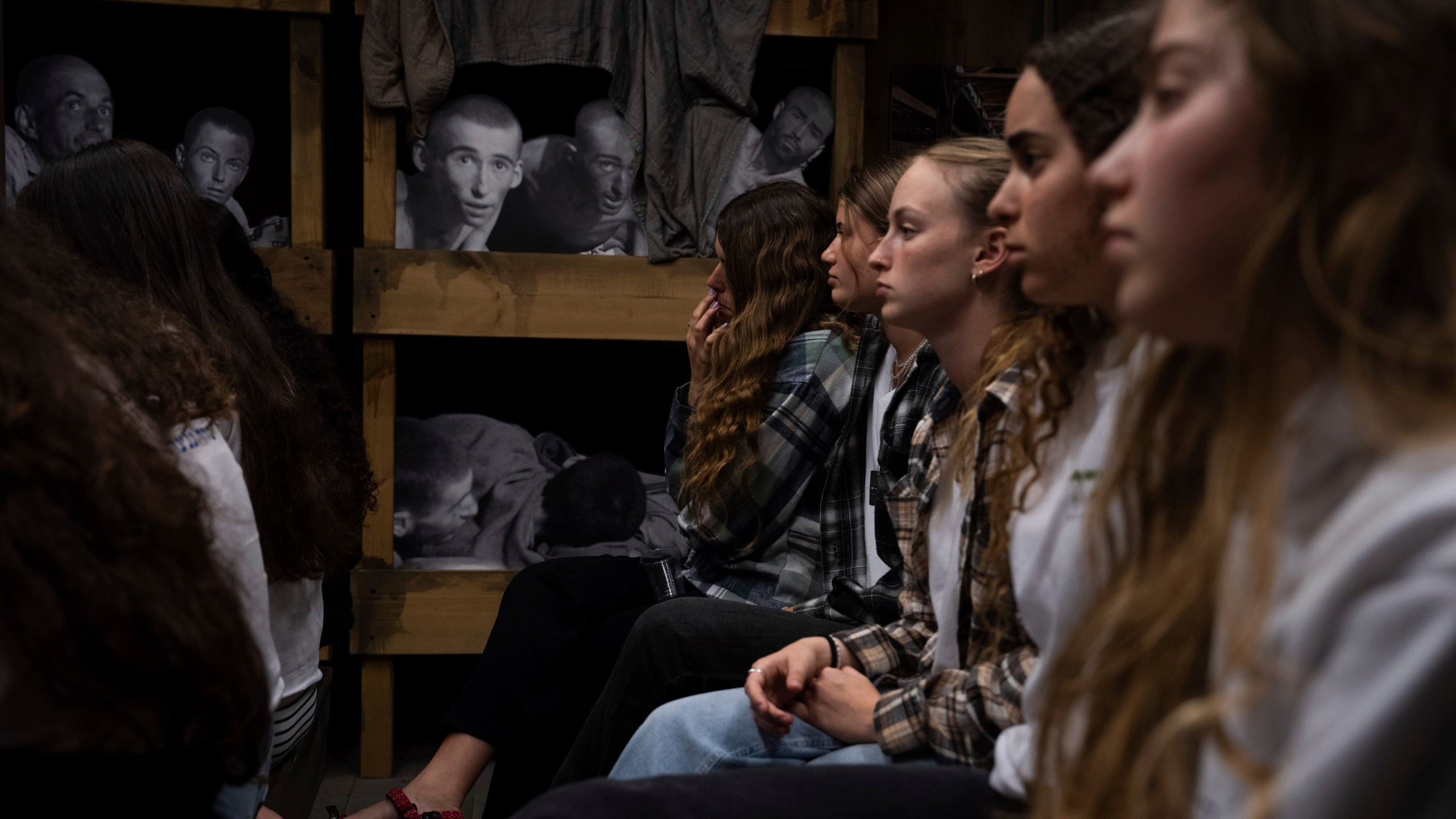 Israeli students listen to a lecture at the Testimony House, a Holocaust museum in Nir Galim, Israel, on the eve of Israel's annual Holocaust Remembrance Day, Sunday, May 5, 2024. Israel holds the day of remembrance each year to remember the six million Jewish victims of the Nazi genocide during World War II. (AP Photo/Oded Balilty)