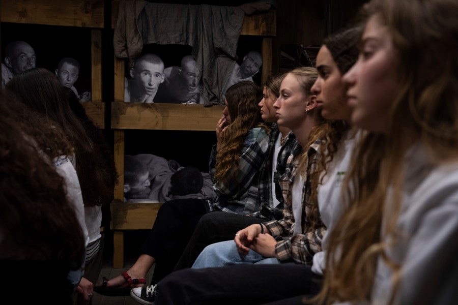 Israeli students listen to a lecture at the Testimony House, a Holocaust museum in Nir Galim, Israel, on the eve of Israel's annual Holocaust Remembrance Day, Sunday, May 5, 2024. Israel holds the day of remembrance each year to remember the six million Jewish victims of the Nazi genocide during World War II. (AP Photo/Oded Balilty)