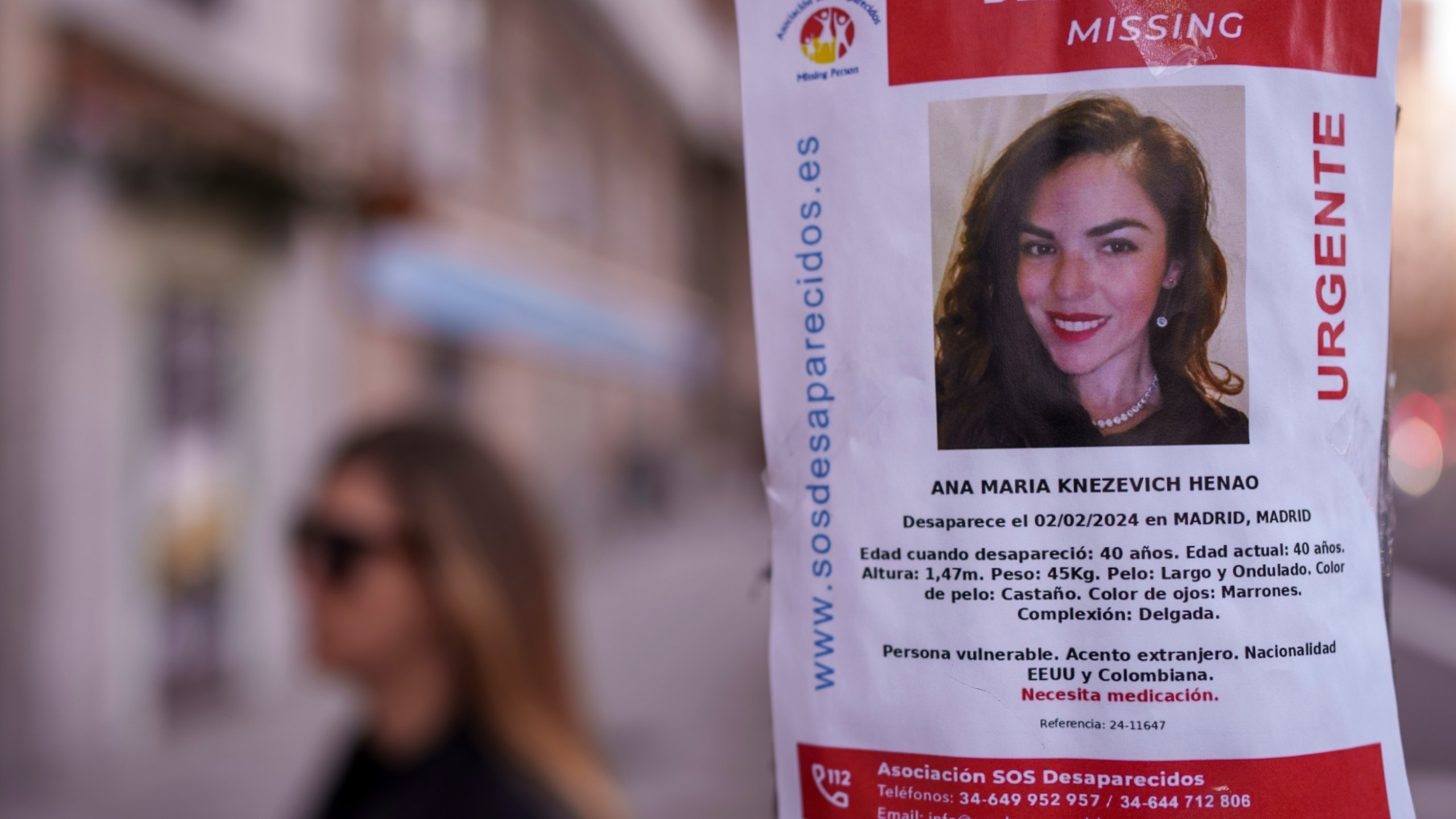 A banner of a Colombian-born American missing woman Ana Maria Knezevich Henao, 40, is displayed on a streetlight in Madrid, Spain, Feb. 16, 2024. The estranged husband of the woman who disappeared three months ago in Spain has been charged by U.S. federal agents with her kidnapping. U.S. marshals arrested David Knezevich at Miami International Airport on Saturday, May 4, 2024. (AP Photo/Manu Fernandez, file)