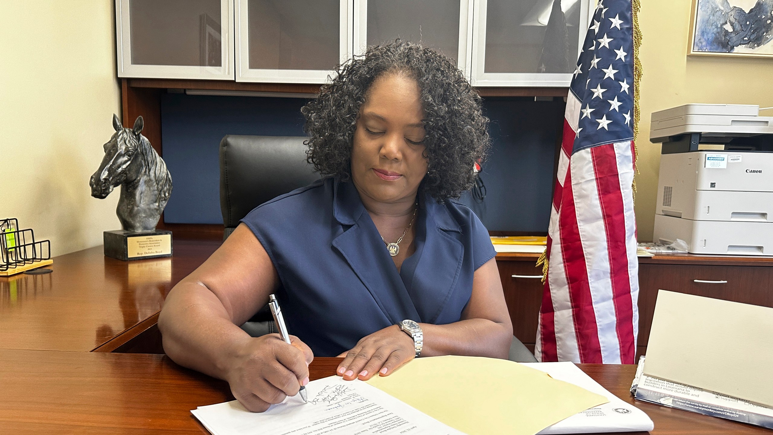 Louisiana Democratic state Rep. Delisha Boyd works at her desk at her office May 3, 2024, in New Orleans. As Boyd faces an uphill battle in Louisiana, as she attempts to advance a bill that would add cases of rape and incest as exceptions to Louisiana's near total abortion ban, the Democrat opens opening up about her mother's harrowing story and how it effected them. (AP Photo/Stephen Smith)