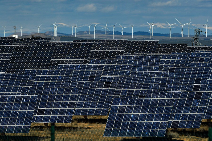 FILE - Solar panels work near the small town of Milagro, Navarra Province, northern Spain, Feb. 24, 2023. Billions of people are using different kinds of energy each day and 2023 was a record-breaking year for renewable energy sources, according to a report published Wednesday, May 8, 2024, by Ember, a think tank based in London. (AP Photo/Alvaro Barrientos, File)