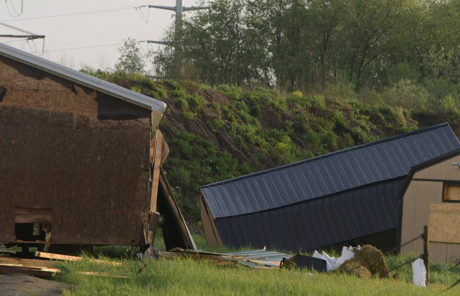 Debris litters the ground near damaged buildings after a tornado swept through the area of the Pavilion Estates mobile home park, in Kalamazoo, Mich., Tuesday, May 7, 2024. Multiple injuries were reported at the park. ( J. Scott Park/Jackson Citizen Patriot via AP)