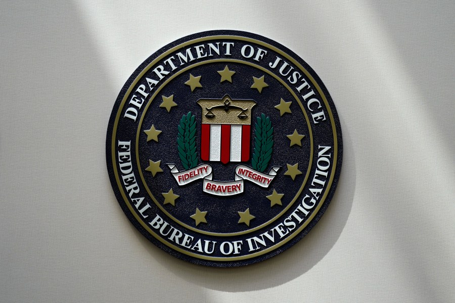 FILE - An FBI seal is seen on a wall on Aug. 10, 2022, in Omaha, Neb. A senior FBI official says the agency is concerned by the potential that foreign adversaries could deploy artificial intelligence as a way to interfere in American elections and spread disinformation. (AP Photo/Charlie Neibergall, File)