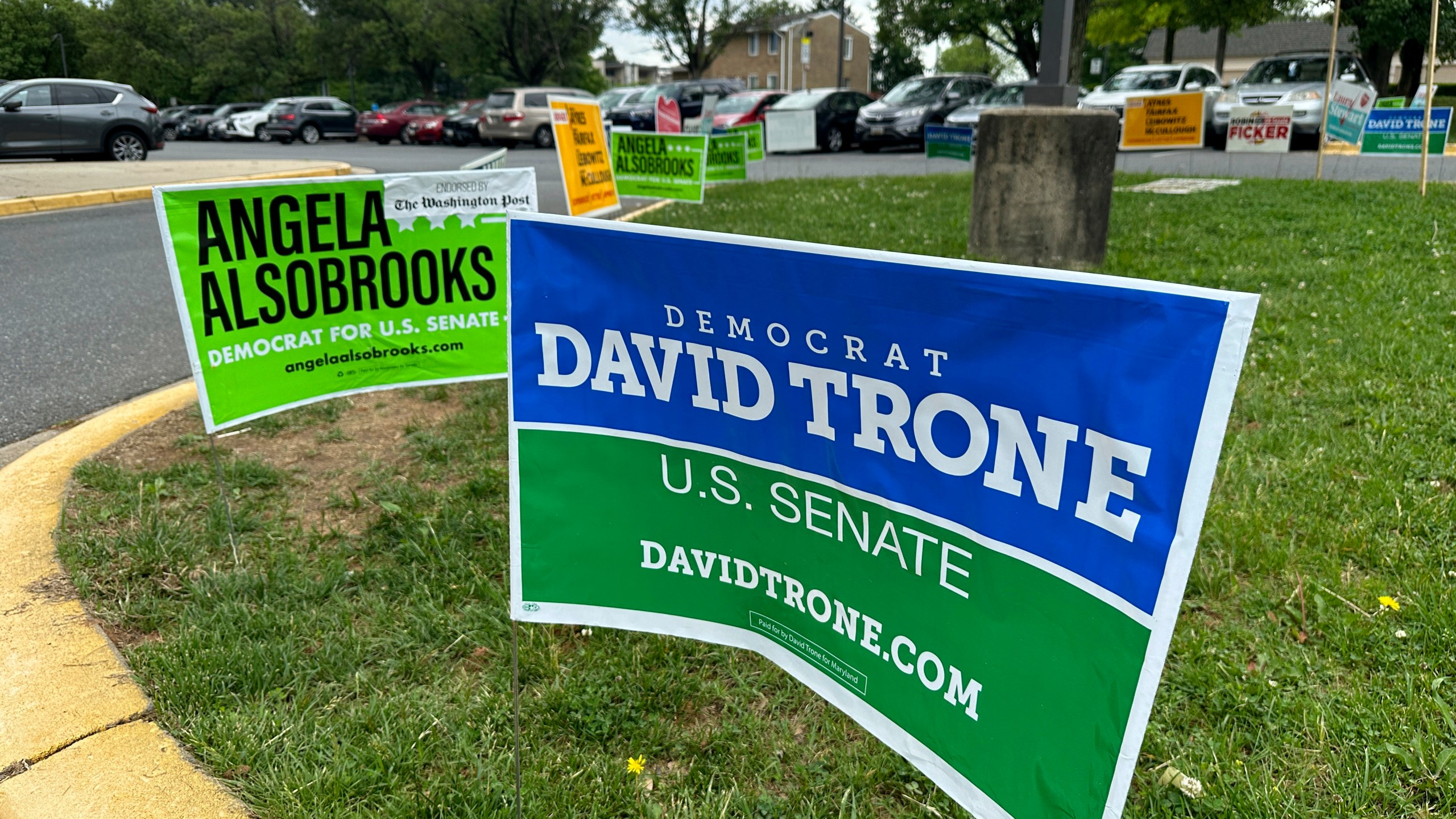 Signs are pictured outside an early voting center on Thursday, May 9, 2024, in Rockville, Md. President Joe Biden and former President Donald Trump look to pad their delegate totals in Maryland Tuesday, May 14. Maryland voters will also decide contested primaries in a Senate race that has further complicated Democratic efforts to keep control of the narrowly divided chamber this fall. The leading Democratic primary candidates are Rep. David Trone and Prince George's County Executive Angela Alsobrooks. (AP Photo/Robert Yoon)