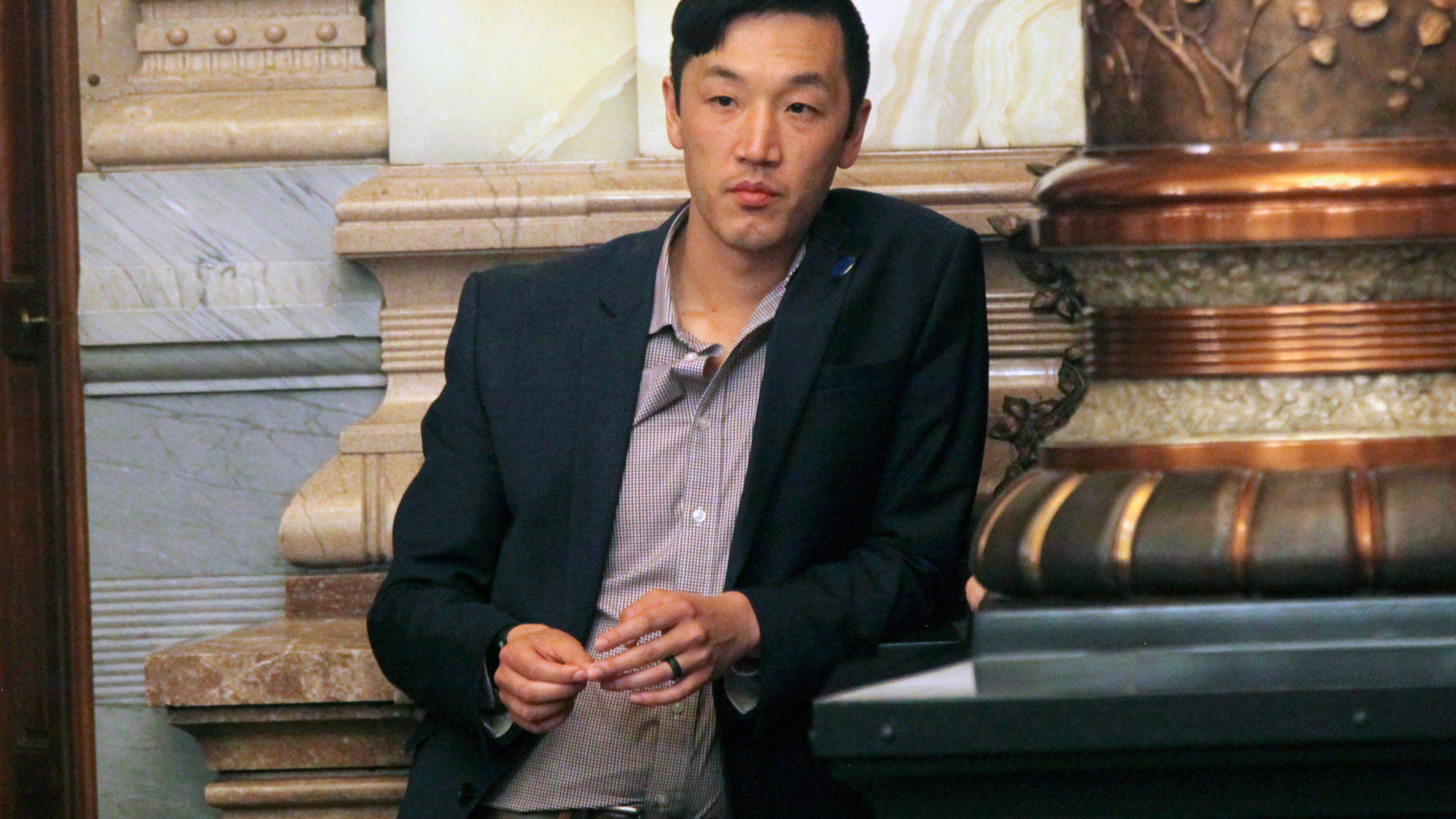 Kansas state Rep. Rui Xu, D-Westwood, watches from the Senate floor as the chamber debates proposed restrictions on foreign ownership of land in Kansas, Saturday, April 6, 2024 at the Statehouse in Topeka, Kan. Xu strongly opposed the bill, viewing it as xenophobic, and Democratic Gov. Laura Kelly has vetoed it. (AP Photo/John Hanna)