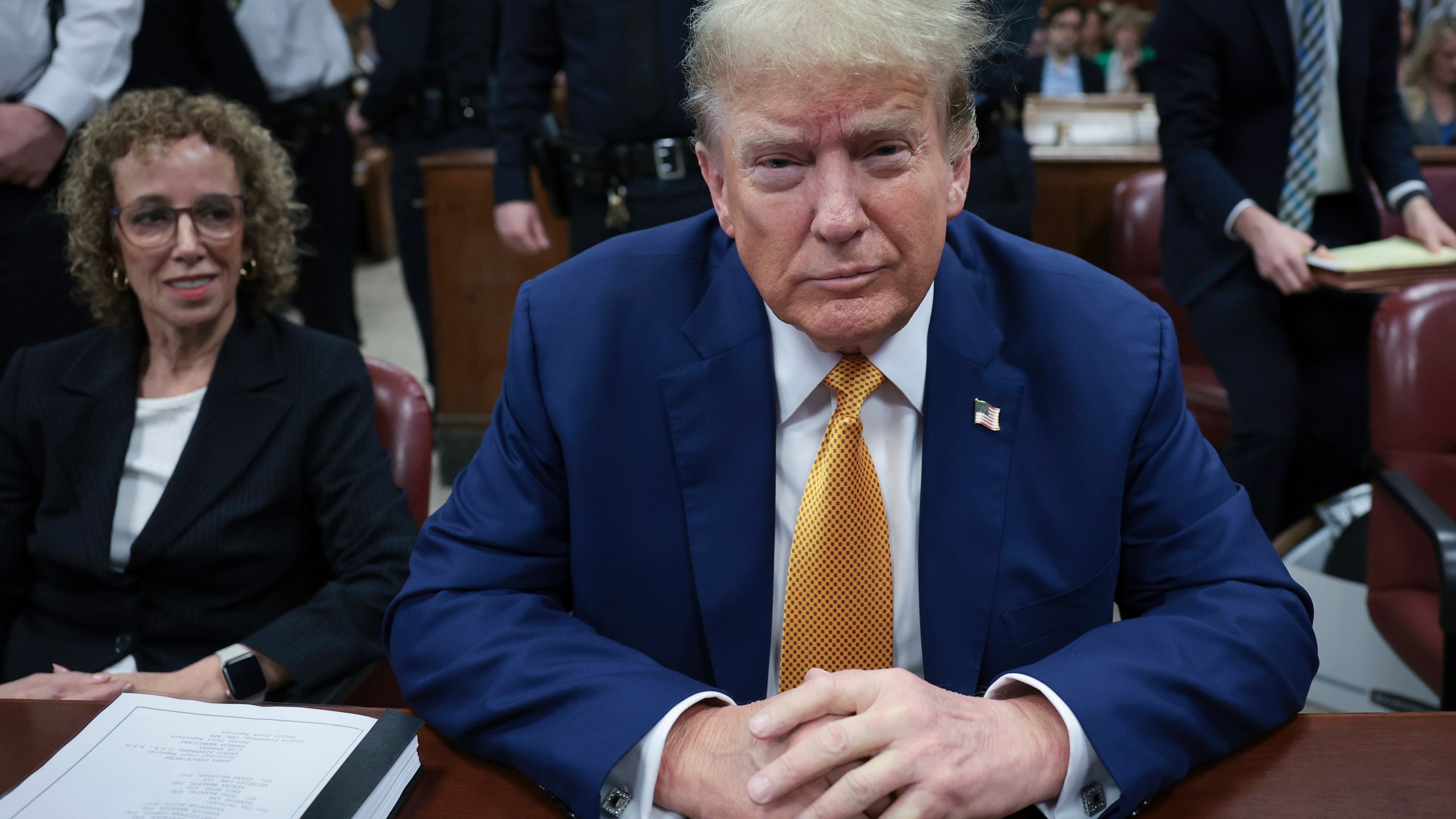 Former President Donald Trump, center, and attorney Susan Necheles, left, attend his trial at Manhattan criminal court on Tuesday, May 7, 2024, in New York. (Win McNamee/Pool Photo via AP)