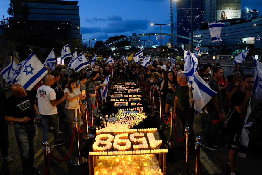 People protest against Israeli Prime Minister Benjamin Netanyahu's government and call for the release of hostages held in the Gaza Strip by the Hamas militant group in Tel Aviv, Israel, Saturday, May 11, 2024. (AP Photo/Ariel Schalit)